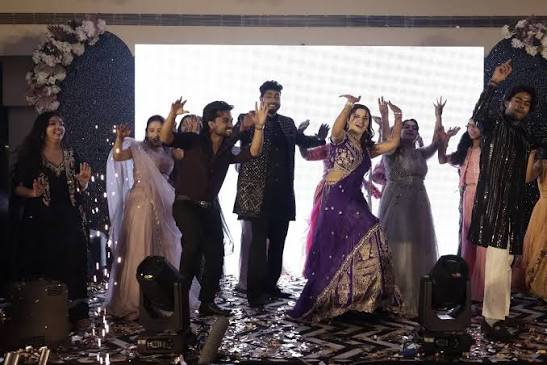 Sister squad flash mob dance revealing the bride at sangeet entry