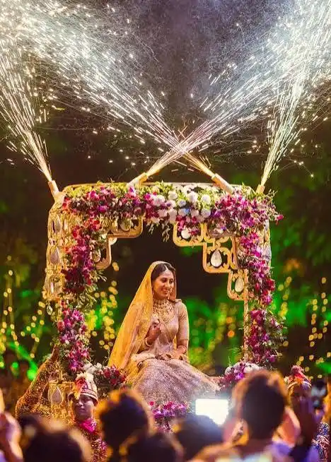 Royal decorated doli palanquin bridal entry at a Rajasthan fort wedding